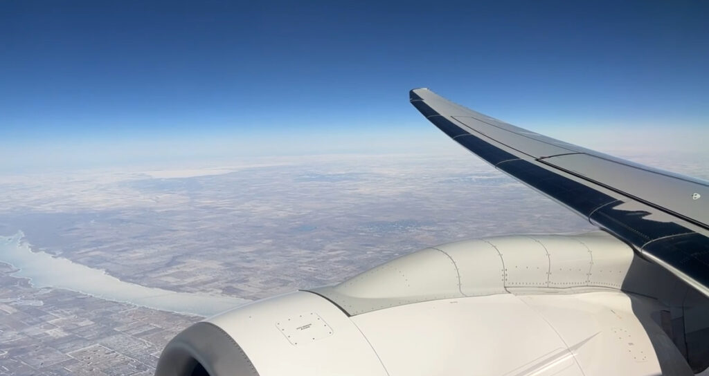 looking at the view from an airplane window